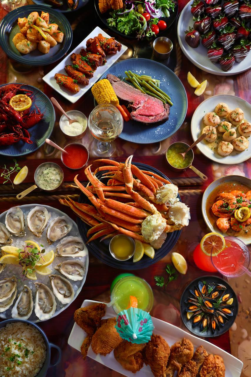 Full seafood and prime rib spread at Pirate's Table — crab legs, oysters, scallops, shrimp, prime rib and more