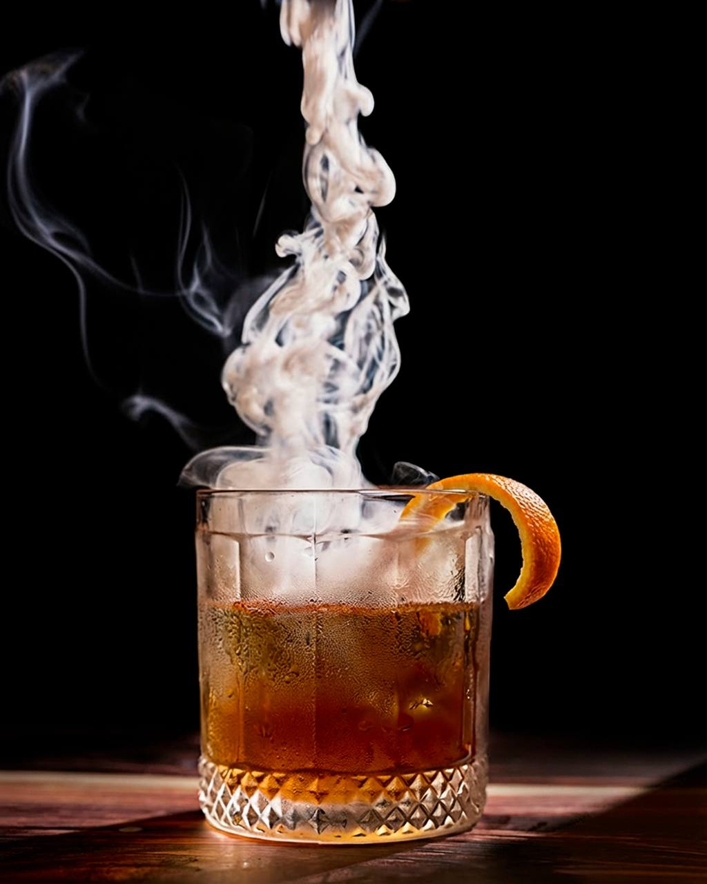 Smoky old fashioned cocktail with dry ice at Pirate's Table bar